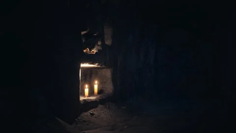 Old dark catacombs with candles Stock-Footage 249816306