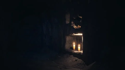 old dark catacombs with candles | Stock Video | Pond5