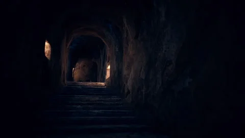 Old dark catacombs with candles Stock-Footage 258046032