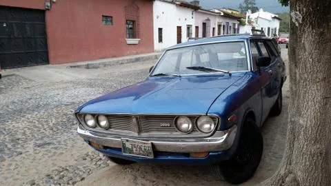 Old Datsun on cobblestone. Stock-Fotos