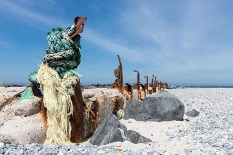 Old decayed breakwater at Dune, small island near Helgoland, Germany Stock Photos