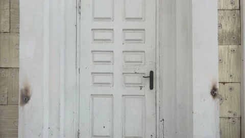 Old decayed white wooden closed door exterior Stock-Footage 151696363