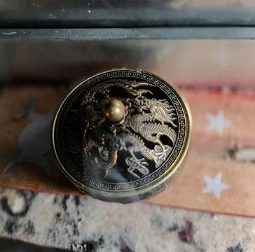 Old decorative object with a dragon Stock Photos