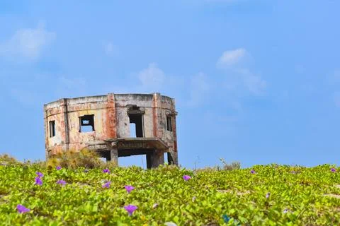 An old decrepit building faces the Seashore near the Preupalem beach of India. Stock Photos
