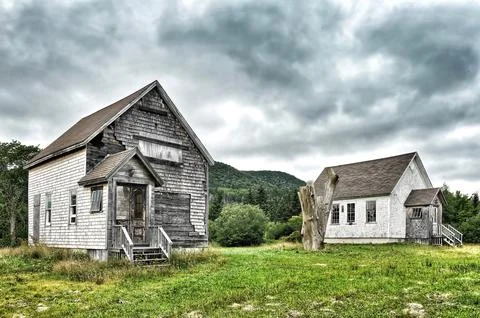 Old decrepit buildings in the country with dramatic sky Stock Photos