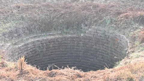 An old deep brick built water well. Stock Footage 336292520