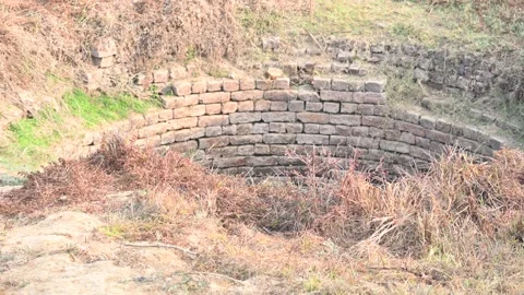 An old deep brick built water well. Video stock 336292524