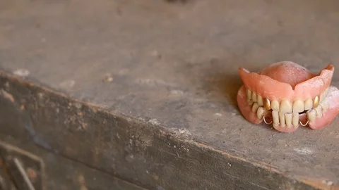 Old denture with golden and missing teeth Stock Footage 88919040