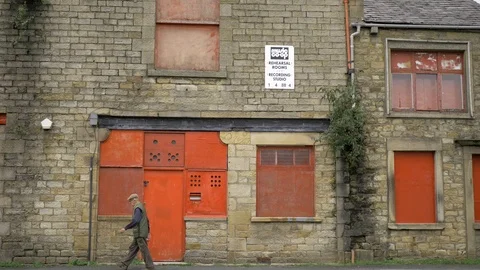 An old derelict building with windows boarded up Video stock 117427003