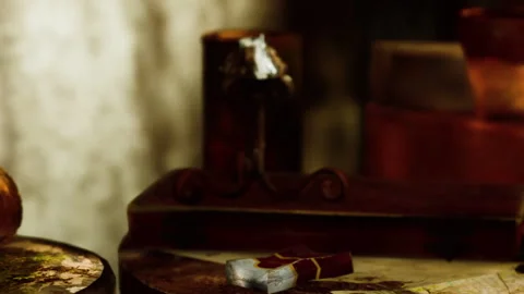 Old desk with items scattered in a dimly lit room during evening hours Stock Footage 345007992
