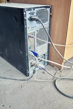 Old desktop pc is covered with a thick layer of dust Stock Photos