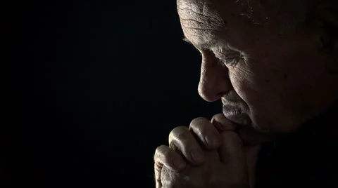 Old desperate man praying in the darkness: desperation, sad old man, sadness Stock Footage 56152186