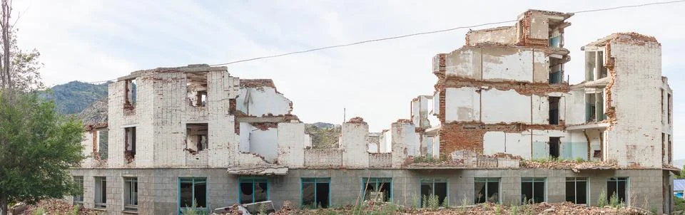 The old destroyed brick multi-storey building Stock Photos
