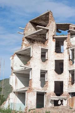 The old destroyed brick multi-storey building Stock Photos