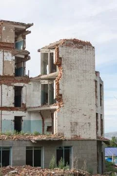 The old destroyed brick multi-storey building Stock Photos