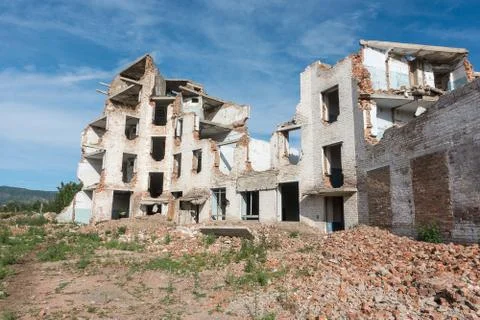 The old destroyed brick multi-storey building Stock Photos