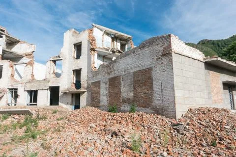 The old destroyed brick multi-storey building Stock Photos
