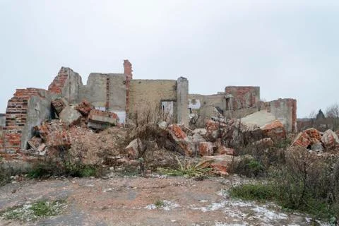 The old destroyed brick multi-storey building. Destroyed Ruined Building Stock Photos
