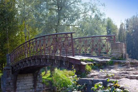The old destroyed bridge in park Stock Photos