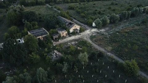 Old destroyed buildings among trees. Aerial Stock Footage 78578745