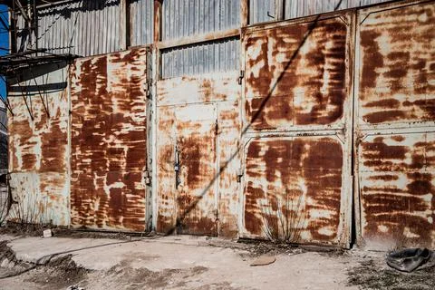 Old destroyed construction site. Rusty scaffolding and construction equipment Stock Photos