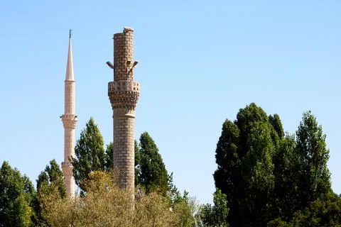 An old destroyed minaret and a solid minaret Stock Photos