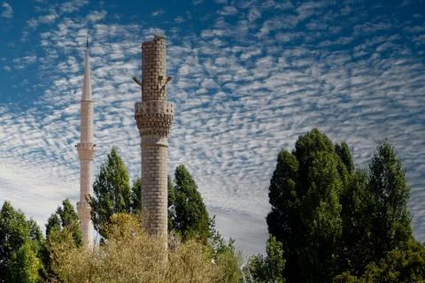 An old destroyed minaret and a solid minaret Stock Photos