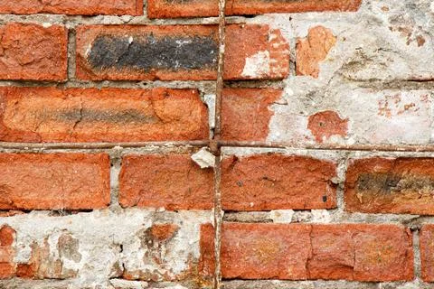 Old destroyed red brick as a background. 스톡 사진