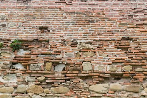 Old deteriorated brick wall background Stock Photos