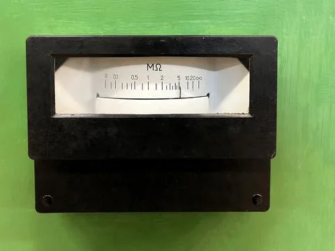 The old device is a megaohmmeter for measuring DC insulation resistance Stock Photos