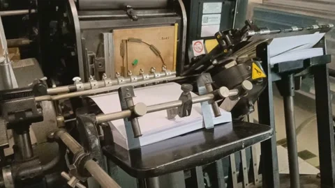 Old die-cutting machine in operation Stock Footage 132826482