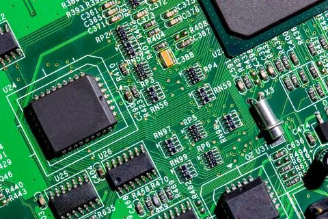 Old digital circuit board with microprocessors and components, closeup full 库存照片
