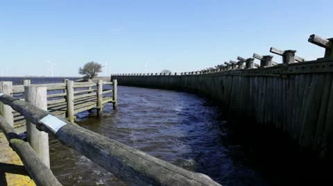 Old dike with windmills Stock Footage 22372874
