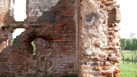 Old dilapidated building of red brick with thick walls and windows Stock Footage 78133651