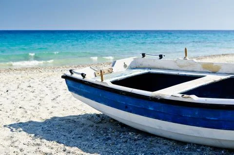 Old dinghy aground Stock Photos