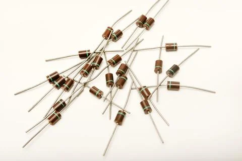 Old diodes. Brown plastic diodes. Old semiconductors with axial leads. Stock Photos