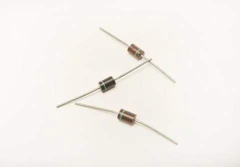 Old diodes. Brown plastic diodes. Old semiconductors with axial leads. Stock Photos
