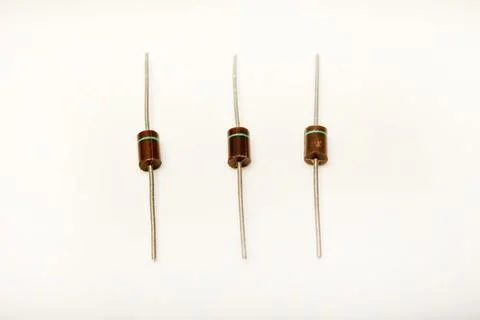 Old diodes. Brown plastic diodes. Old semiconductors with axial leads. Stock Photos