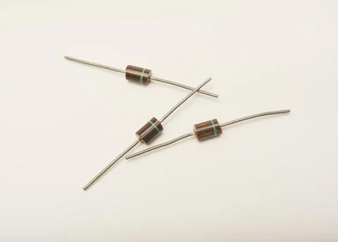 Old diodes. Brown plastic diodes. Old semiconductors with axial leads. Stock Photos
