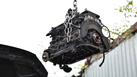 Old dirty car engine block lifting for repair Video stock 322028309