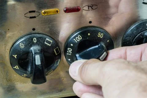 An old dirty gas kitchen. Device for preparing dishes in the kitchen. Stock Photos