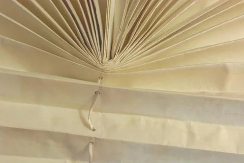 Old dirty gray window blinds with rope Stock Photos
