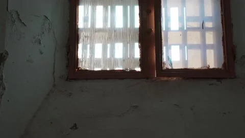 Old dirty little window with a thick wall. window of an old house. Video stock 143877931
