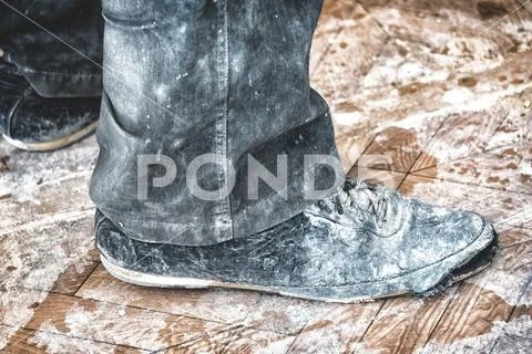 Old dirty ripped shoes Stock Photos