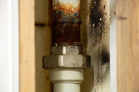 Old dirty rusty pipe in a bathroom in a residential apartment without repair, Stock Photos