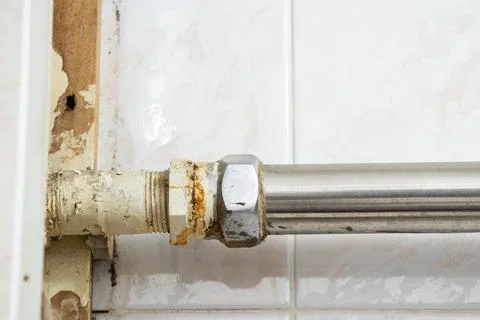 Old dirty rusty pipe in a bathroom in a residential apartment without repair, Stock Photos