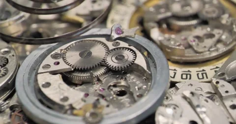 Old disassembled mechanical wrist watch. Metal parts of old mechanical watch Stock Footage 250026692