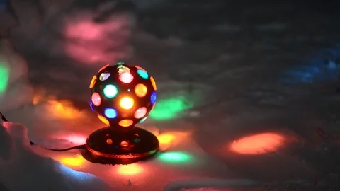The old Disco ball spinning while standing on the white snow. Stock Footage 120327557