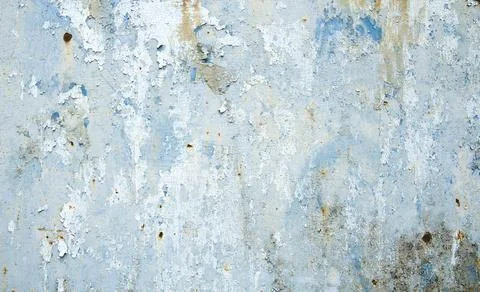 Old distressed grungy wall with blue peeling pint Stock Photos