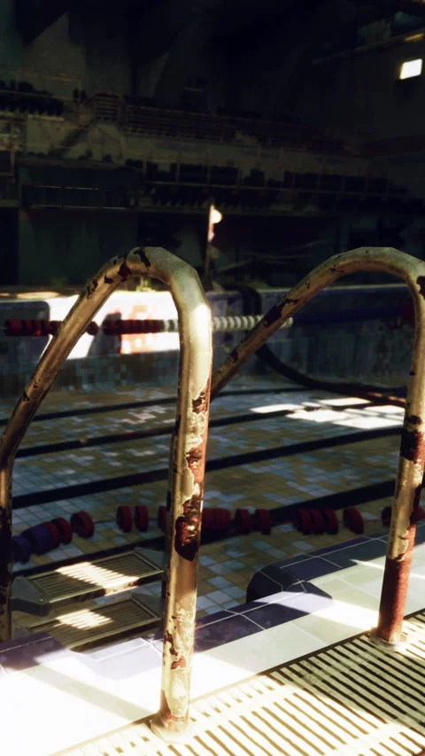 Old diving board and pool lane at a public swimming facility Stock Footage 339417452